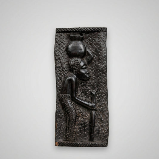 female carved african wall plaque