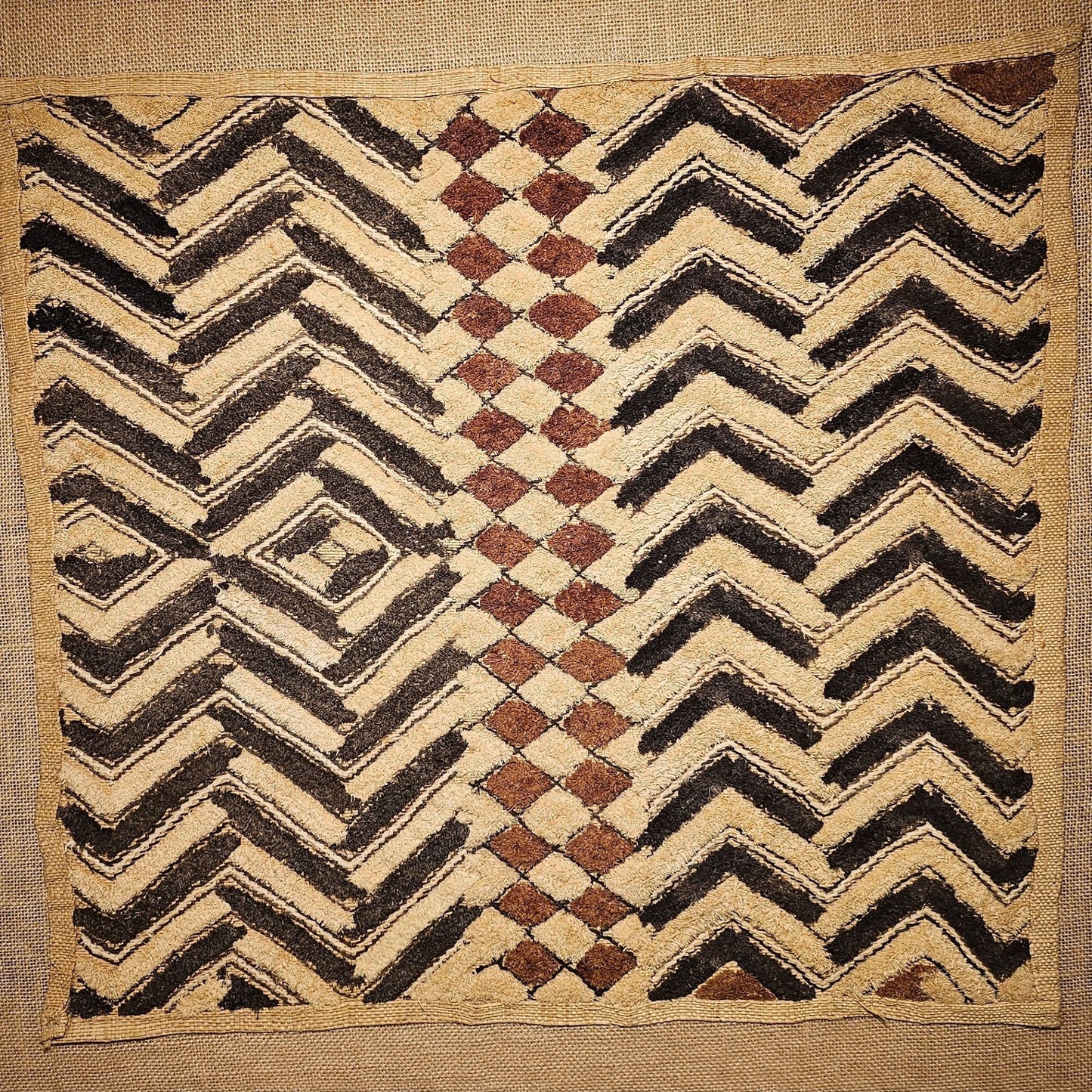 Textile with zigzag and diamond pattern on a beige background - AfrahouseAfrican Art
