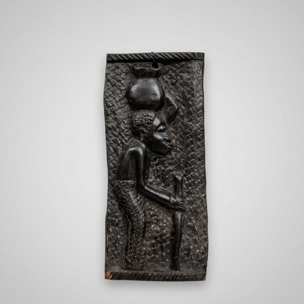 female carved african wall plaque
