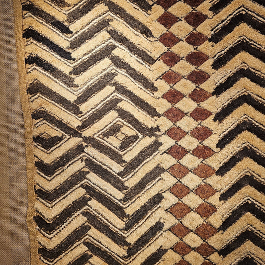 Close - up of a patterned rug with zigzag and checkered designs. - AfrahouseAfrican Art
